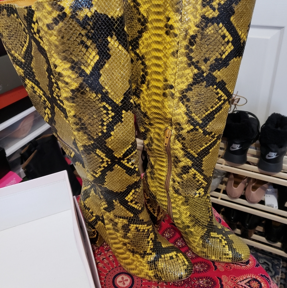 Snakeskin yellow and black knee high boots